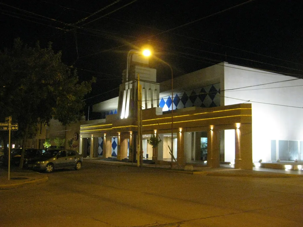 Casino Corral de Bustos lit up at night on its street corner — Casino Corral de Bustos